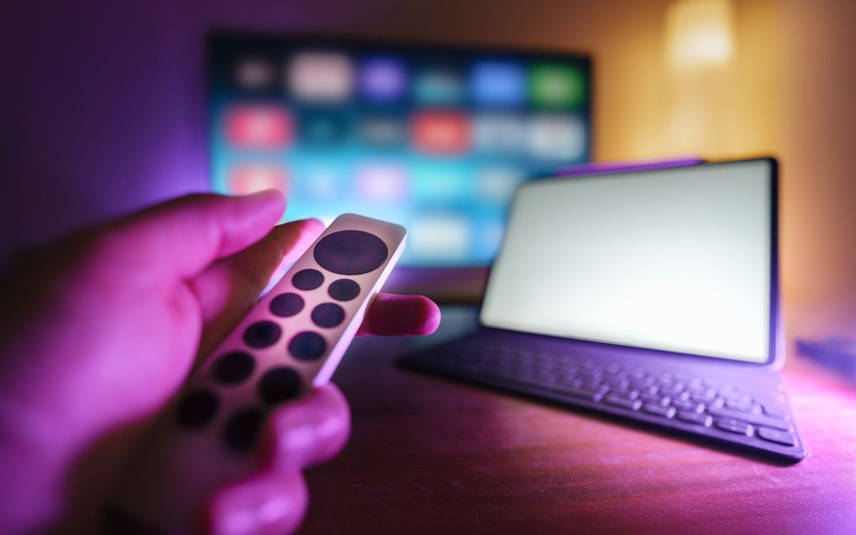 A television and laptop in a home entertainment setting
